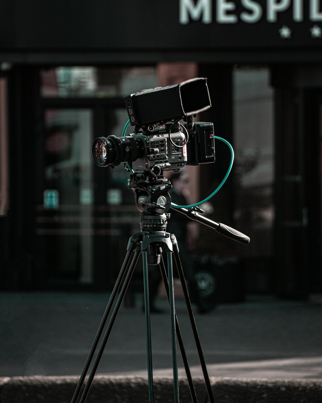 Professional broadcast camera on tripod in television studio