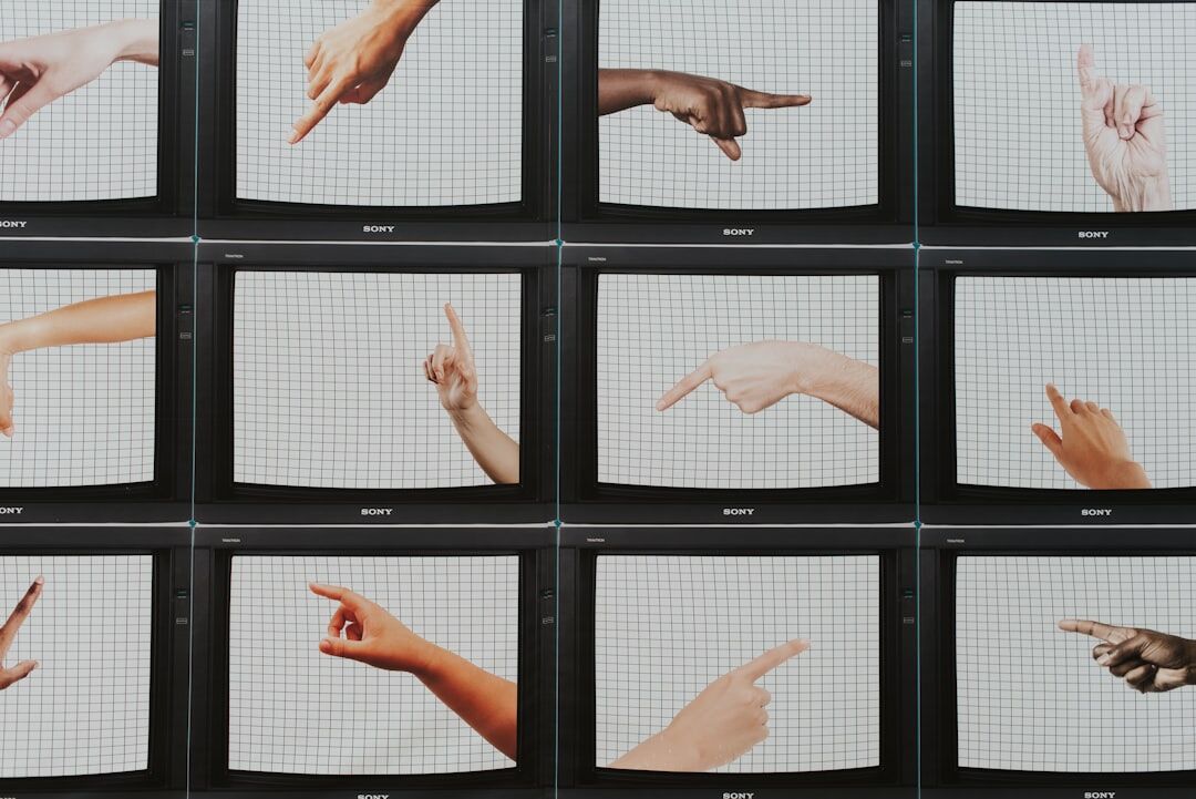 Wall of broadcast video monitors displaying live camera feeds
